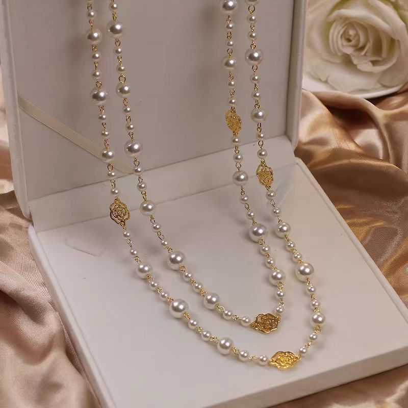 A pearl necklace suits your beauty and elegance.