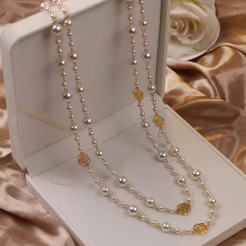 A pearl necklace suits your beauty and elegance.