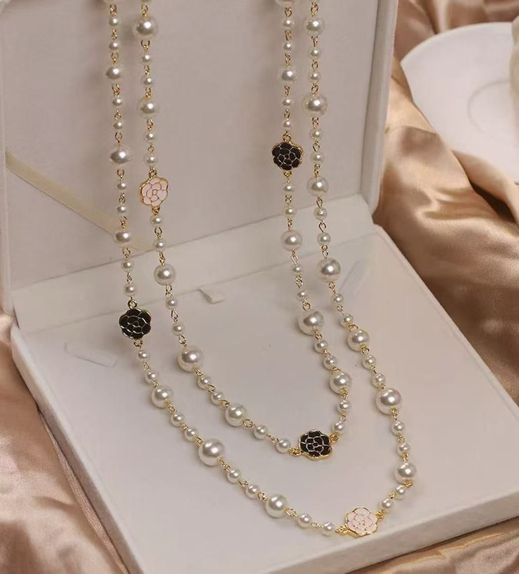 A pearl necklace suits your beauty and elegance.