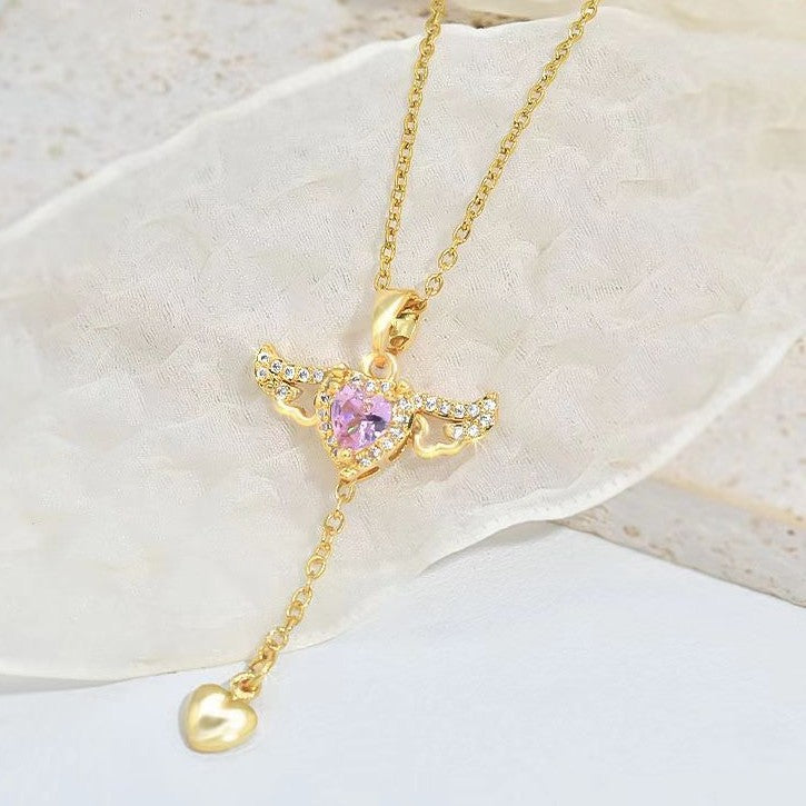 A moving pendant in the shape of a heart and wings, perfect for your innocence.