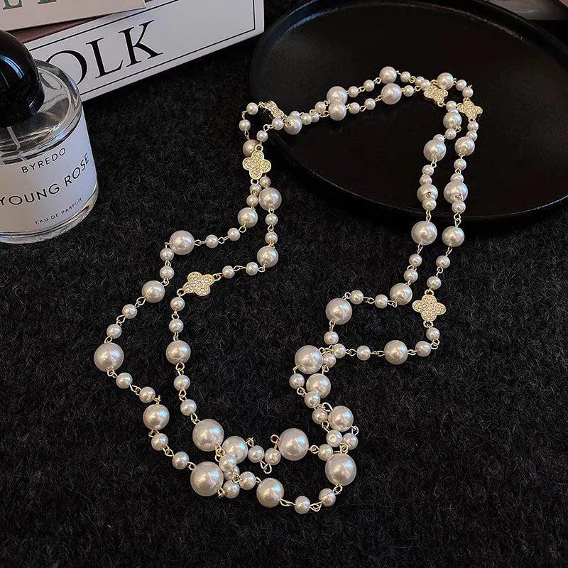 A pearl necklace suits your beauty and elegance.