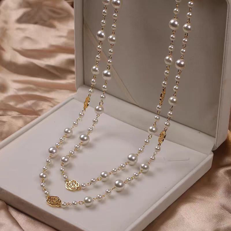 A pearl necklace suits your beauty and elegance.
